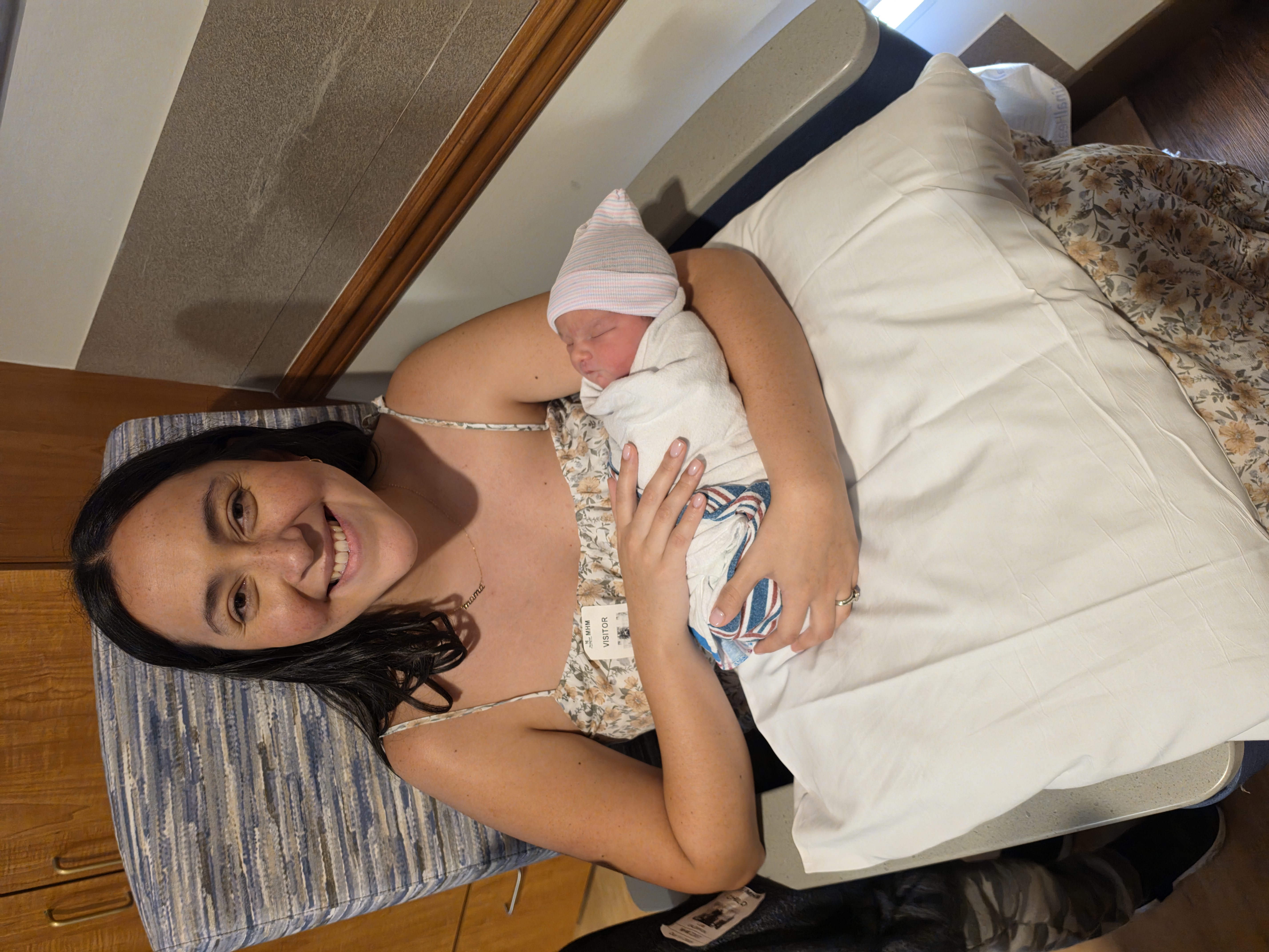 A tender moment holding a swaddled newborn